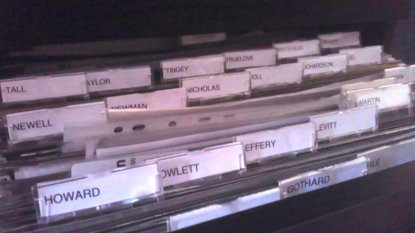 Surname files in a filing cabinet