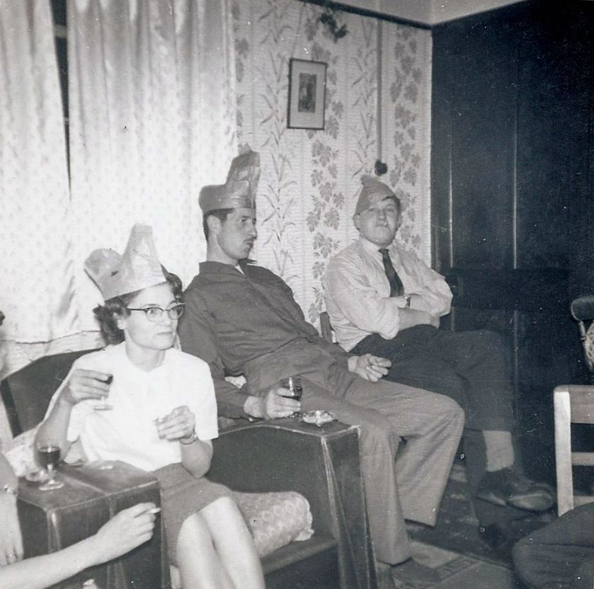 My uncle Norman (seated right) and cousins, all wearing unusual Christmas hats. Photo: Andrew Martin